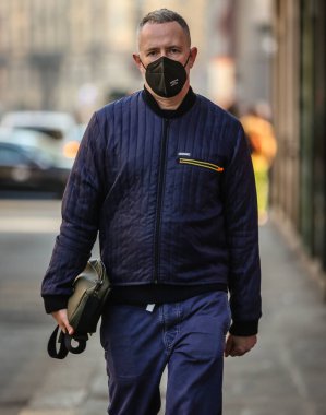 MILAN, Italy- January 16 2022: Men on the street in Milan.