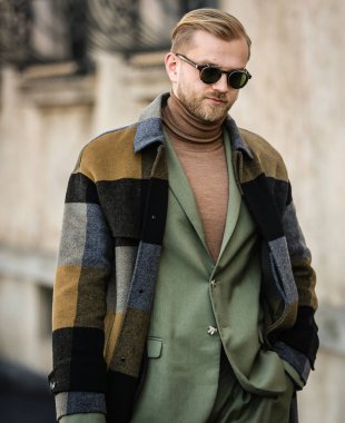 MILAN, Italy- January 16 2022: Men on the street in Milan.