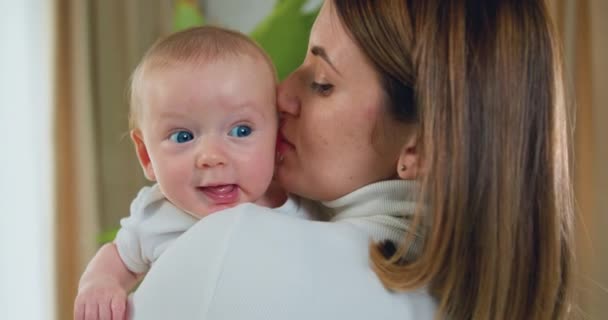 Close Happy Woman Kisses Newborn Baby Young Mother Holding Her — Stock Video