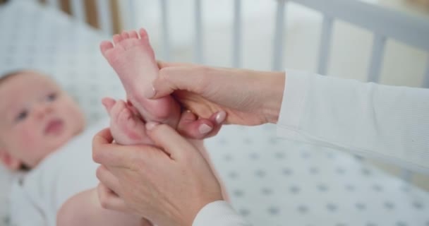 Closeup Woman Holding Babys Legs Gently Stroking Hand His Tiny — Stock Video