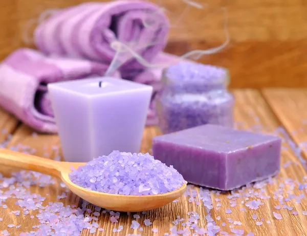 Purple candle and sea salt — Stock Photo, Image