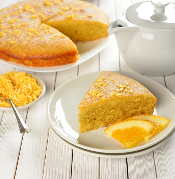 Orange cake on a white table — Stock Photo, Image