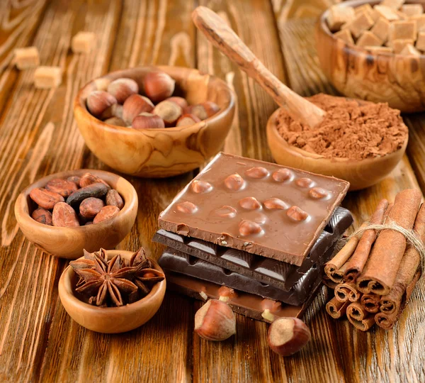 Chocolate, nuts and spices — Stock Photo, Image