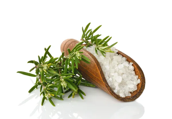 Salt in a wooden scoop and rosemary — Stock Photo, Image