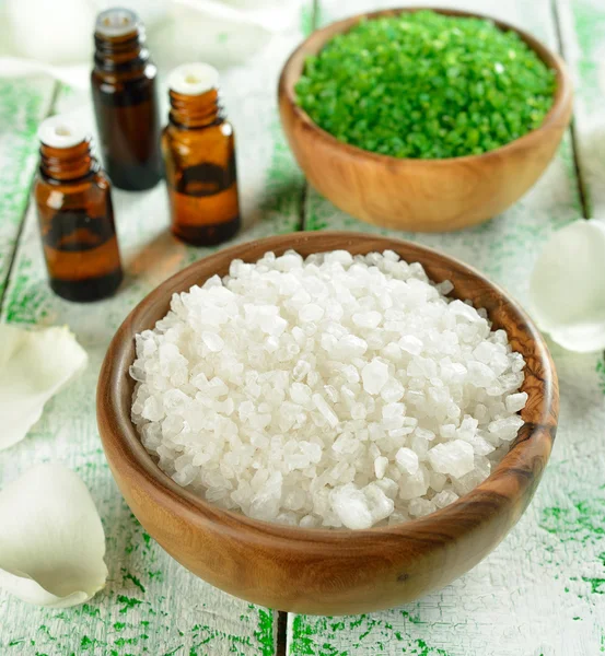 Salt in a wooden bowl and essential oil — Stock Photo, Image