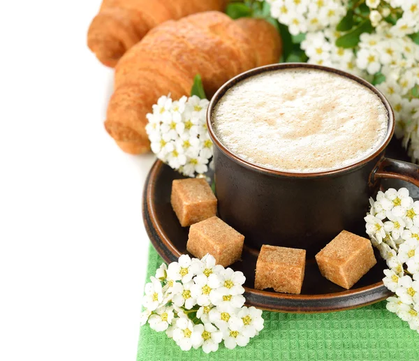 Coffee and flowers on a white background