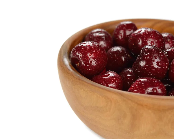 Fresh cherries in a wooden bowl — Stock Photo, Image