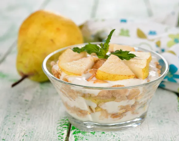 Dessert of muesli and yogurt with pear — Stock Photo, Image