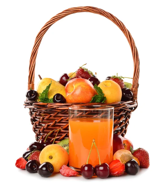 Various fruit in a brown basket and juice — Stock Photo, Image