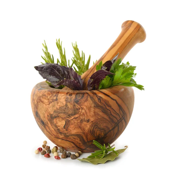 Herbs in wooden mortar — Stock Photo, Image