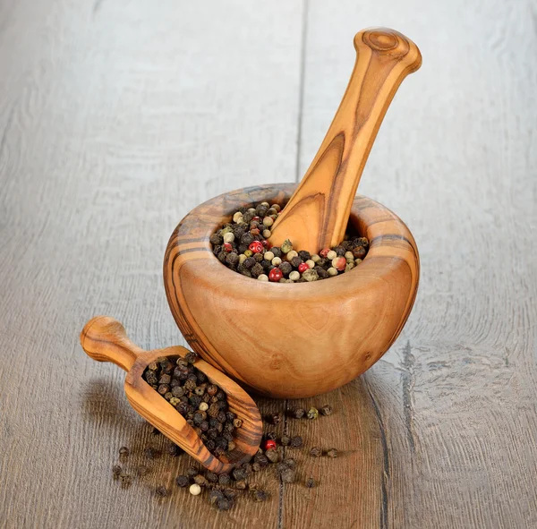 Wooden mortar and spices — Stock Photo, Image