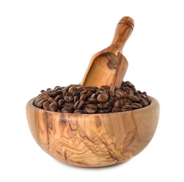 Koffiebonen in een houten kom — Stockfoto