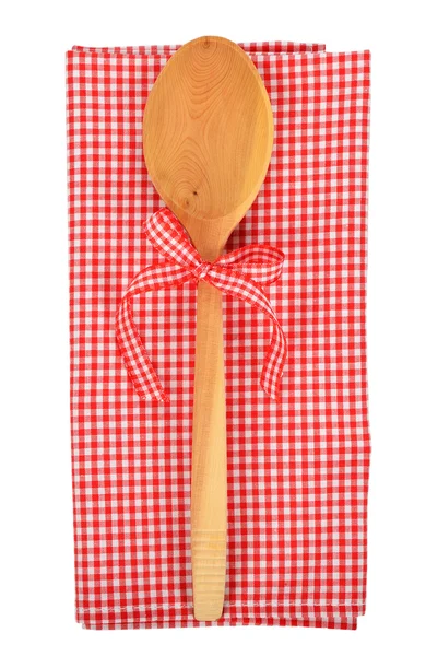 Wooden spoon and red napkin — Stock Photo, Image