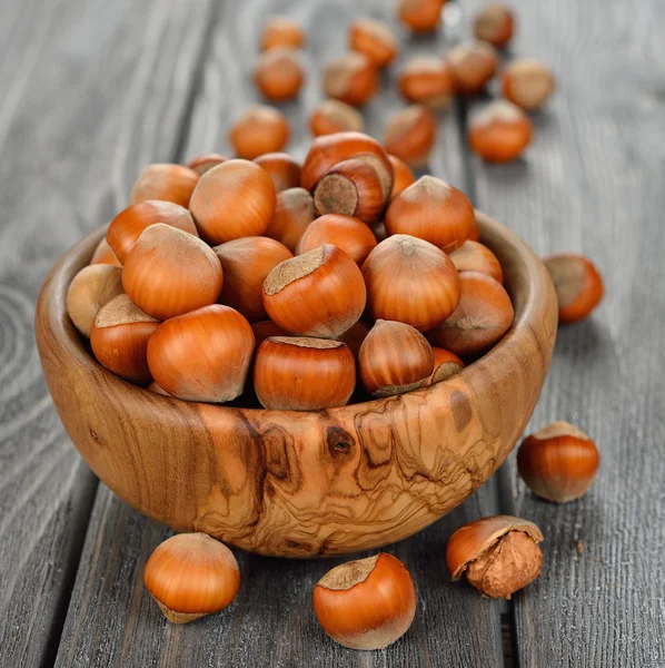 Hazelnuts in a wooden bowl — Stock Photo, Image