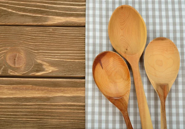 Wooden spoon and napkin — Stock Photo, Image