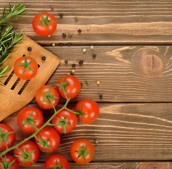 Tomatoes and rosemary — Stock Photo, Image