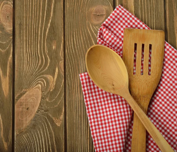 Wooden spoon and napkin — Stock Photo, Image