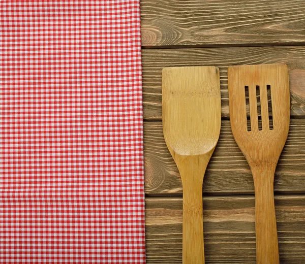 Wooden spoon and napkin — Stock Photo, Image