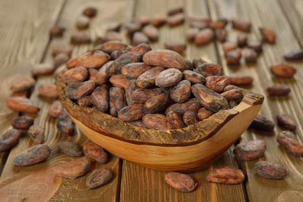 Cocoa beans in a wooden bowl — Stock Photo, Image