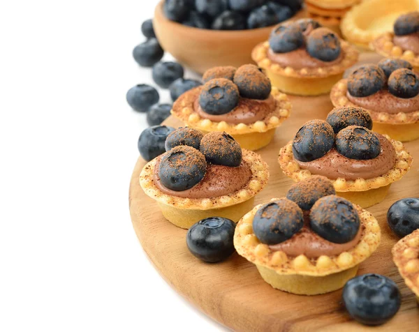 Tartlets with chocolate cream and blueberries — Stock Photo, Image