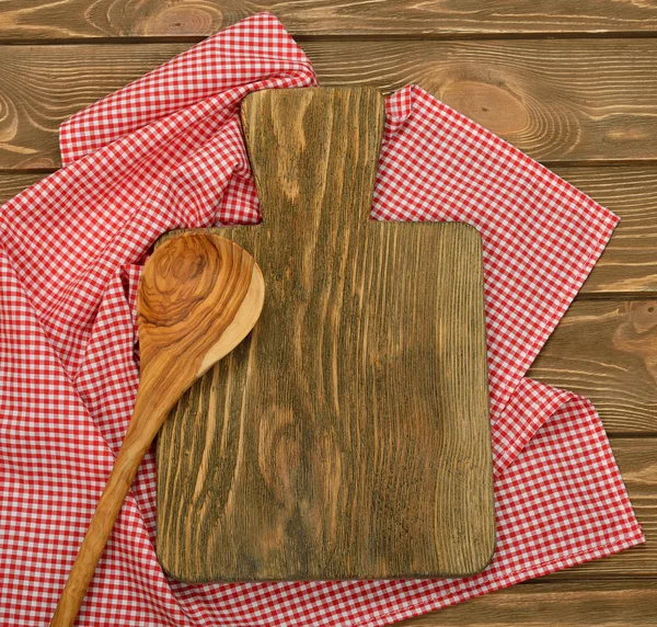 Cutting board and red napkin — Stock Photo, Image