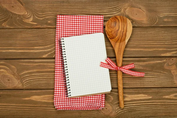 Wooden spoon and napkin — Stock Photo, Image