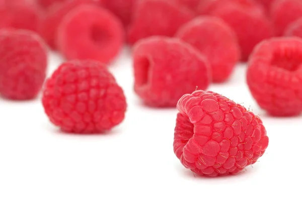 Scattered raspberry on white background — Stock Photo, Image