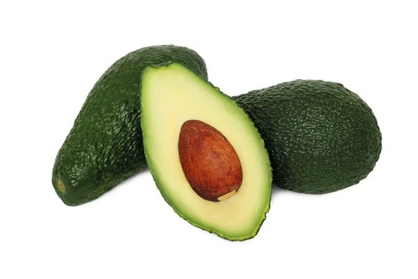 Zwei volle und eine halbe Avocados — Stockfoto