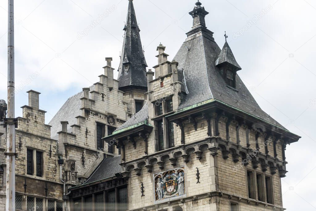 Antwerp, Belgium, Europe, a castle with a clock at the top of a building