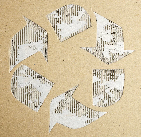 Recycle symbol on cardboard texture — Stock Photo, Image