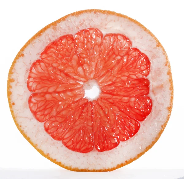 Slice of grapefruit isolated on white background — Stock Photo, Image