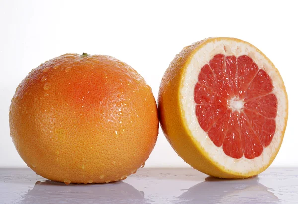 Grapefruit with half isolated on white background — Stock Photo, Image