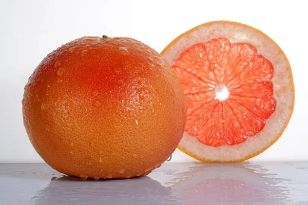 Grapefruit with half isolated on white background — Stock Photo, Image