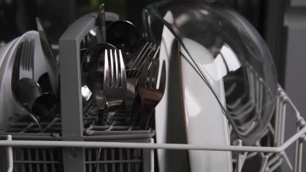 Clean washed dishes in the dishwasher — Stock Video