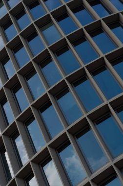 Abstract modern building background for design, office building facade with large glass windows