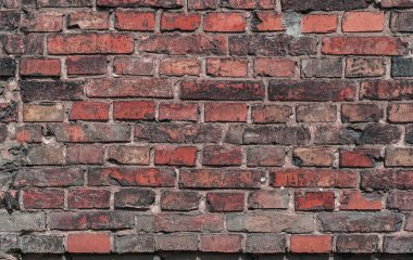 Eski bir tuğla duvarın dokusu. Metin için alanı olan boş kırmızı tuğla duvar arkaplanı