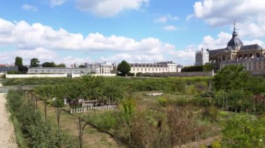 Versailles, France - August 26 2022: Pan shot over the Kings Kitchen Garden Potager du Roi. It was built in1678-1683 by French gardening Jean-Baptiste La Quintinie, at the request of Louis XIV.