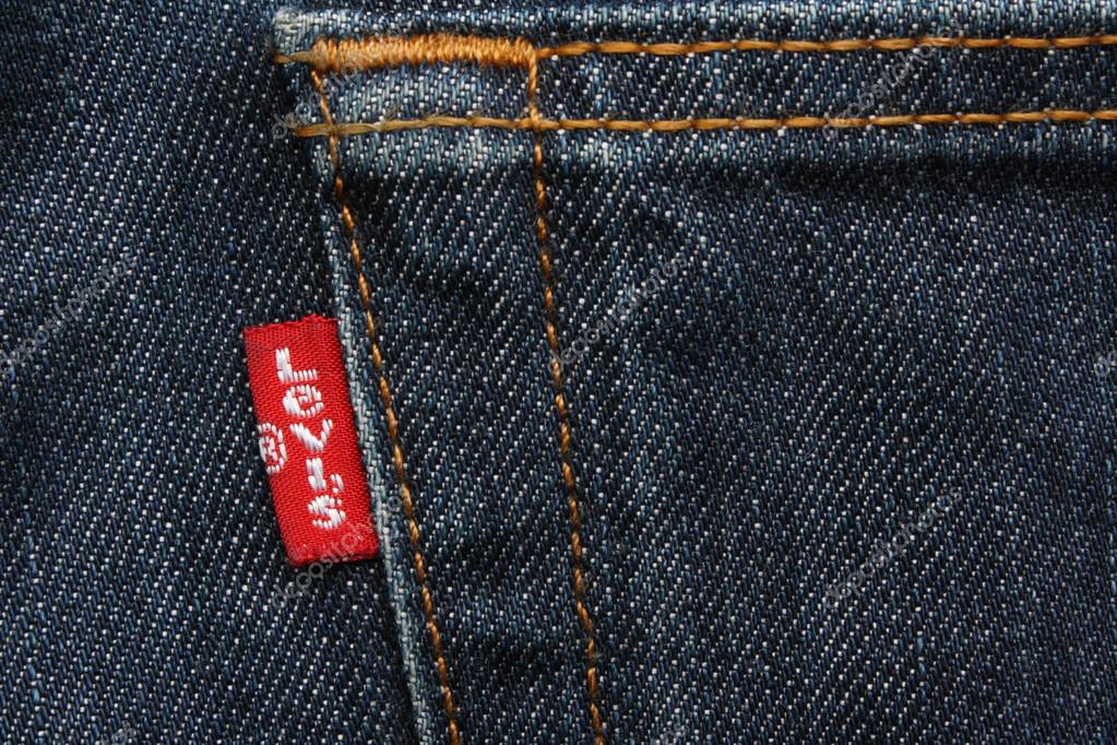 London, United Kingdom - April, 18 2011: The Levis red label on the back pocket of a pair of denim jeans. Levis is a brand name of Levi Strauss and Co, founded in 1853