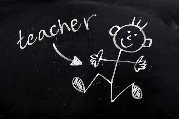 Gelukkig leraar op een schoolbord — Stockfoto