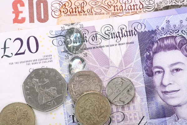 Billetes y monedas británicos — Foto de Stock