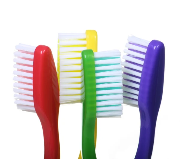 Cuatro cepillos de dientes —  Fotos de Stock