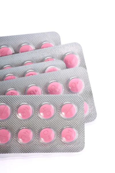 Píldoras rosadas en paquetes de ampollas — Foto de Stock