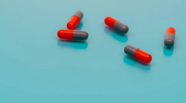 Gray Orange Antibiotic Capsules Pill Spread Blue Background Pharmacy Banner — Stock Fotó