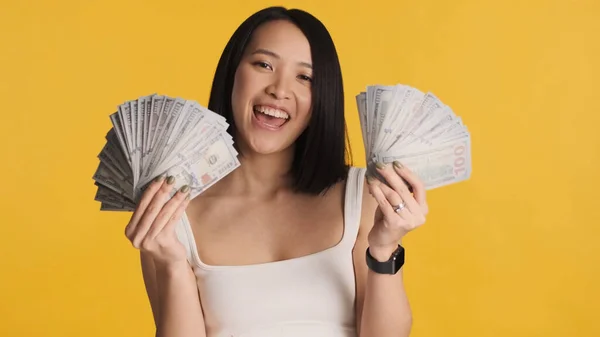 Excited Rich Asian Woman Showing Wad Money Smiling Camera Yellow — Stock Photo, Image
