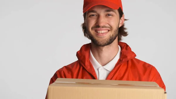 Portrait Delivery Man Holding Parcel Customer Smiling Camera Isolated Attractive — Stock Photo, Image