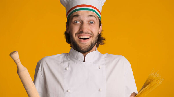 Excited Male Chef Dressed Uniform Holding Wood Rolling Pin Pasta Royalty Free Stock Images