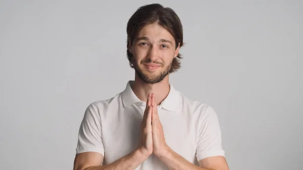 Attractive Brunette Guy Keeping Palms Pressed Together Asking Something Looking — Stock Photo, Image