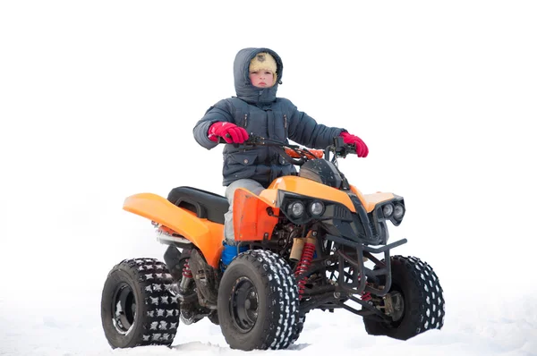 Um menino montando um ATV — Fotografia de Stock