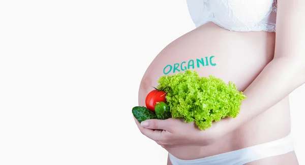 Pregnant belly with "organic" sign isolated — Stock Photo, Image