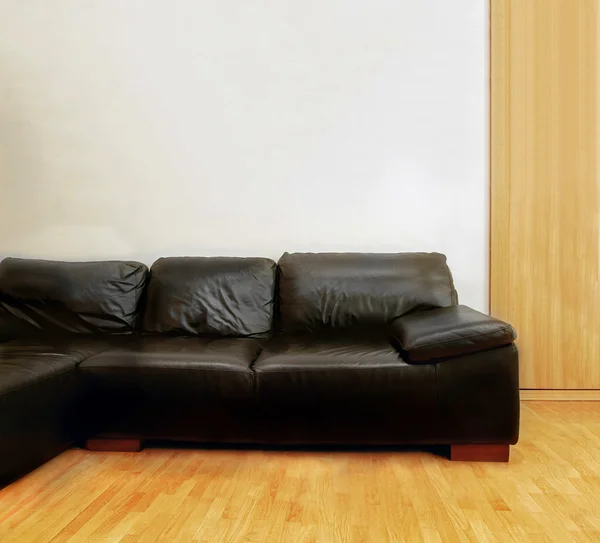 Black leather couch — Stock Photo, Image